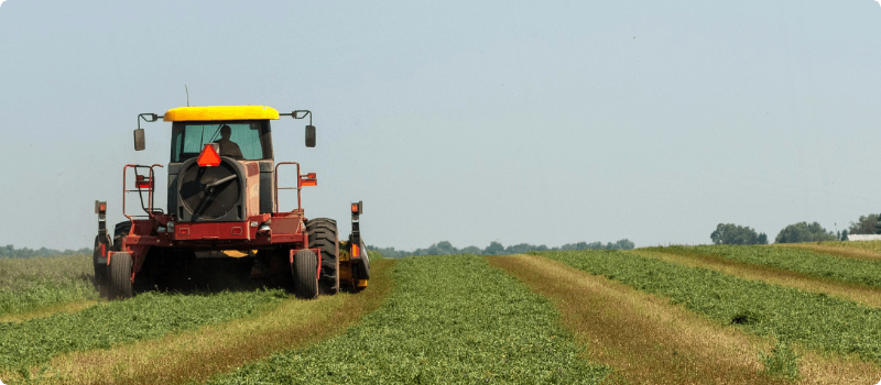 A tractor driving in a field.