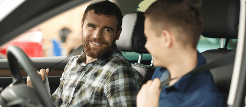 Man test driving a used car from a private owner. 
