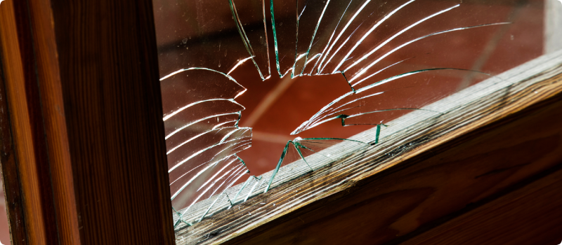 a hole in a damaged window