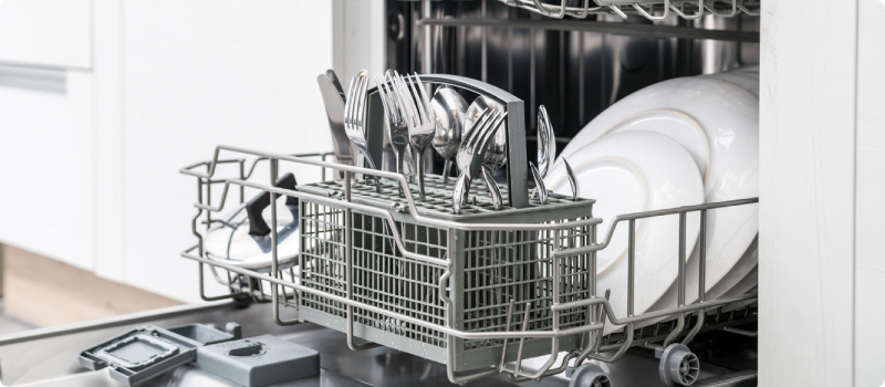 an open dishwasher full of dishes