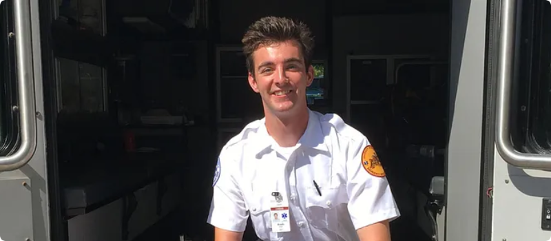 Brady Kutz sitting at the back of an ambulance