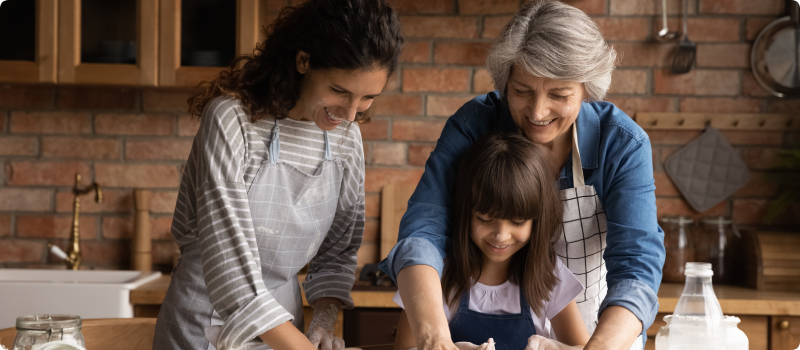 three generations of women cooking