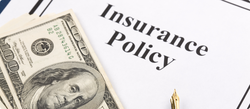 an insurance policy and money