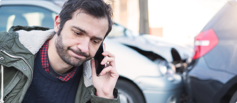man on the phone after a car accident