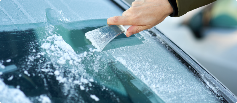 scraping ice off a windshield