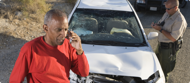 a man making a call after a car accident
