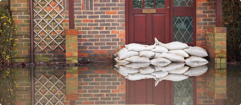 a house sandbagged against floodwaters