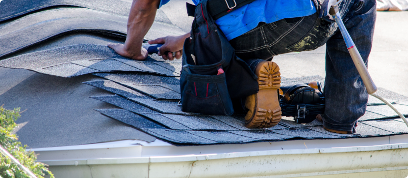 Man repairing a home roof