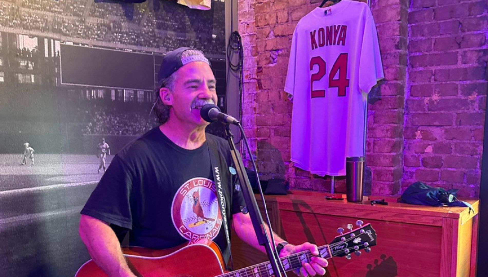 Singer on stage with guitar