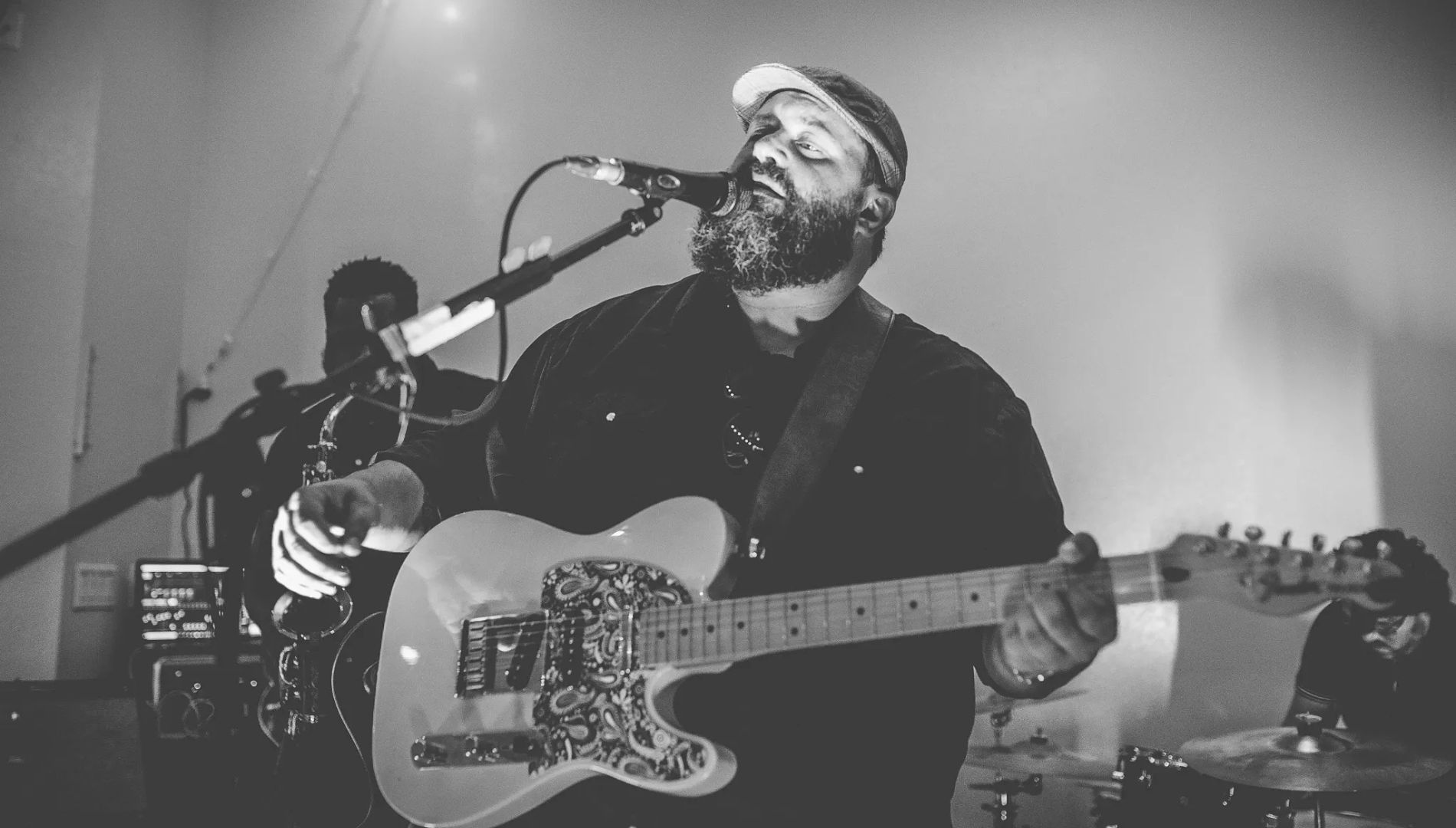 Singer on stage with guitar