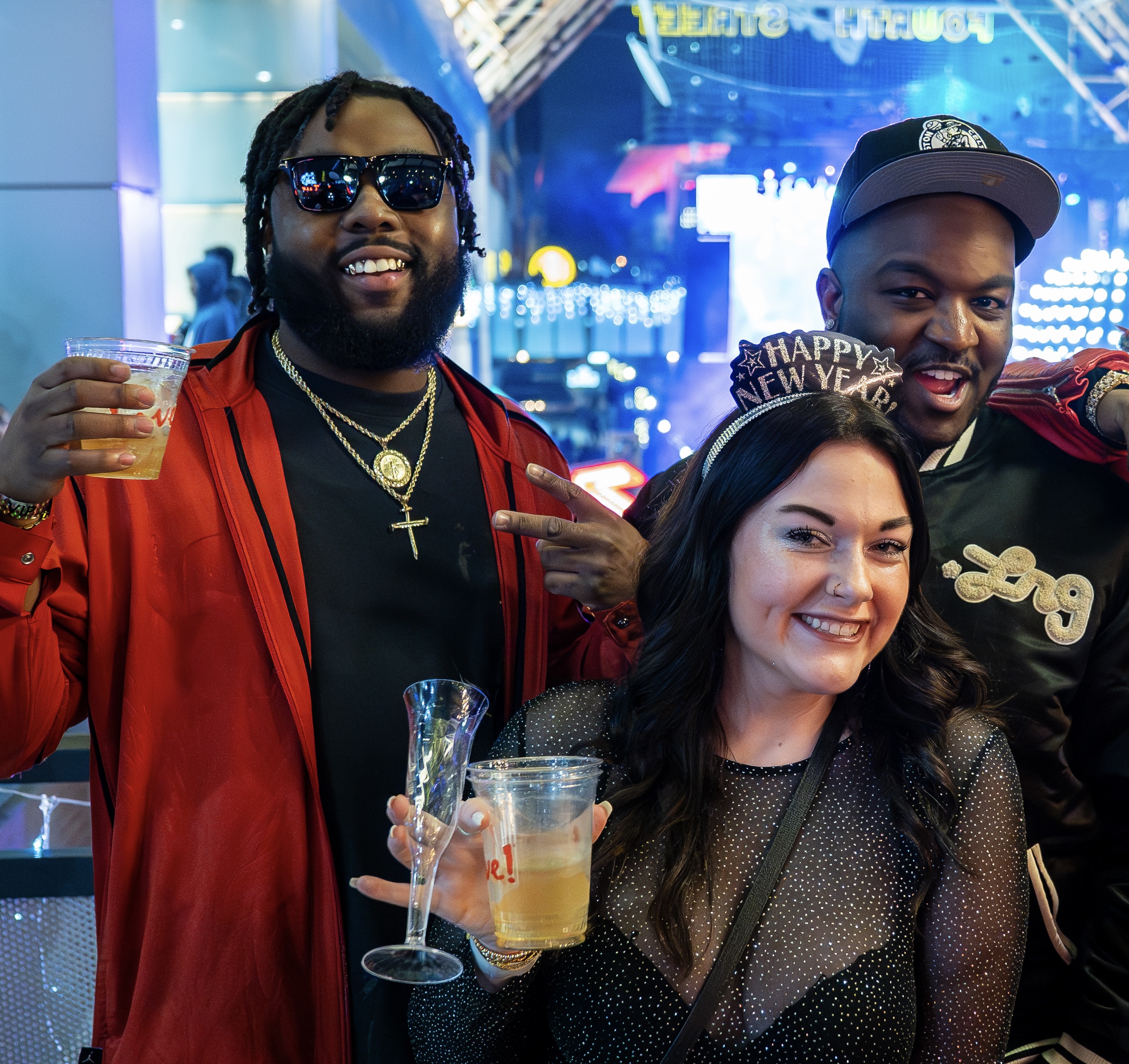 An image of people holding up drinks at NYE Live!
