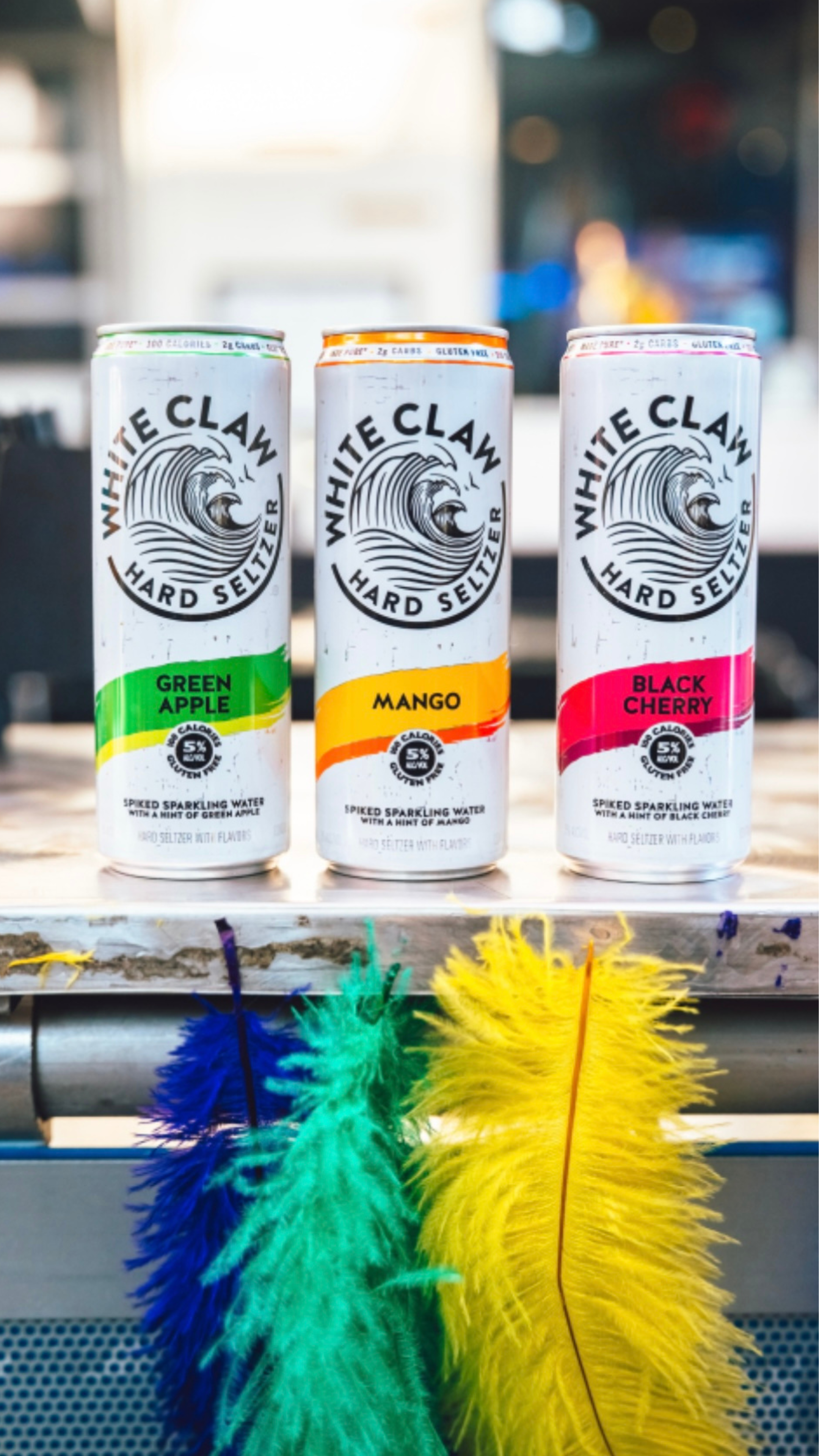 An image of 3 White Claw cans.