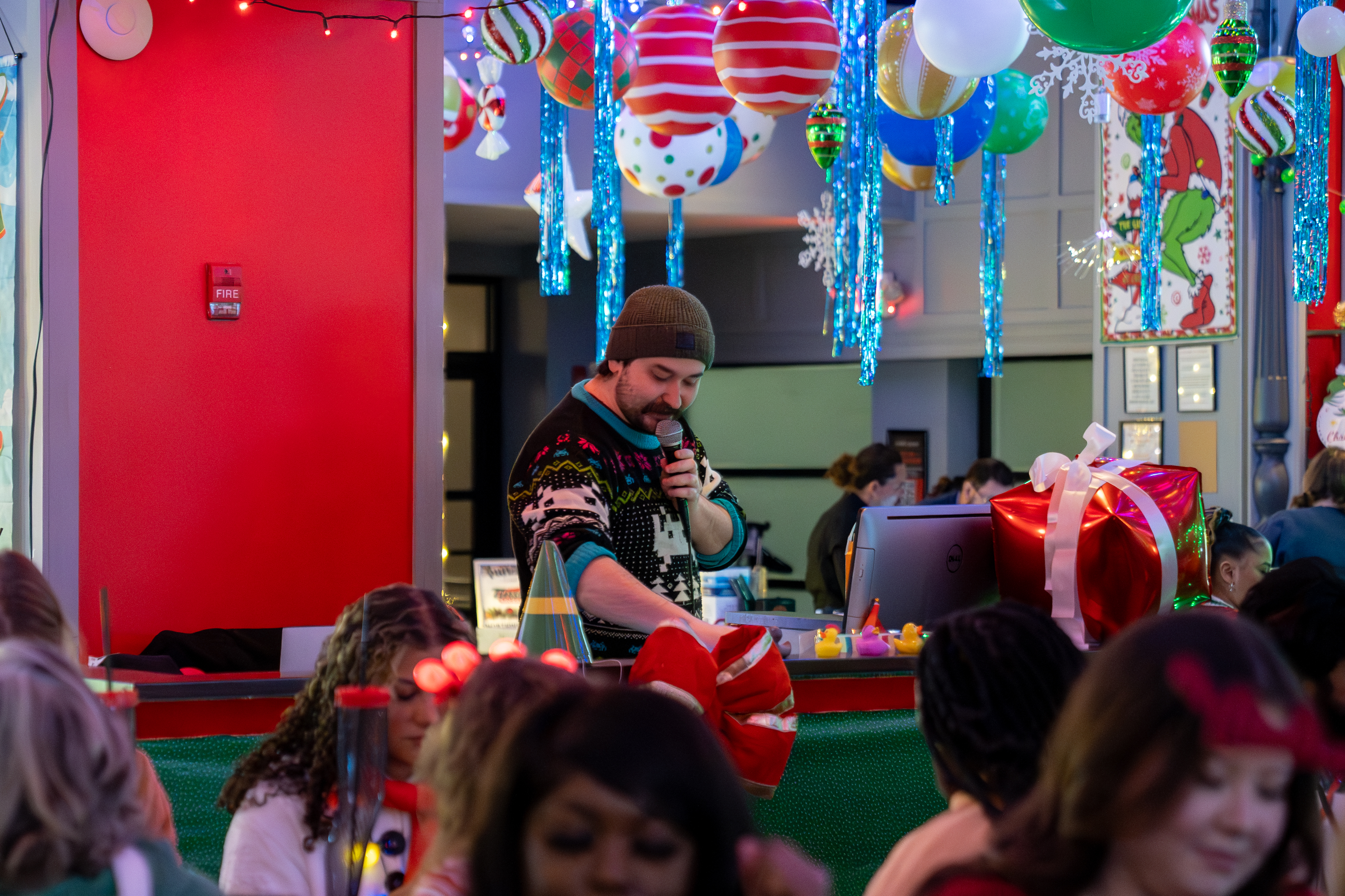 An image of a DJ speaking at Tinsel Tavern.