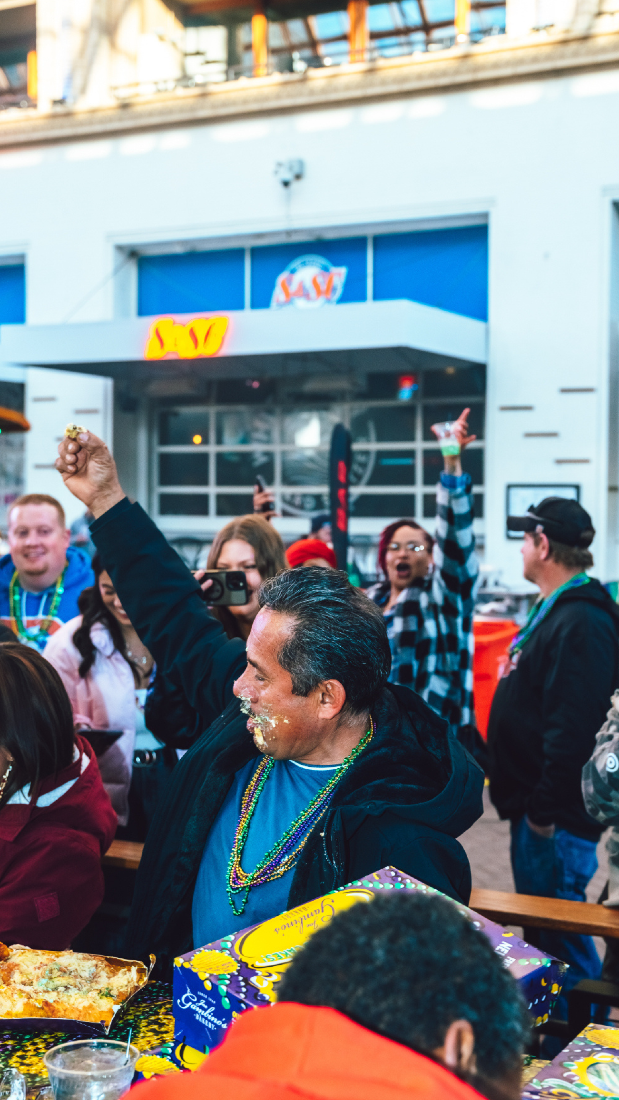 A man finding the baby in a King Cake.
