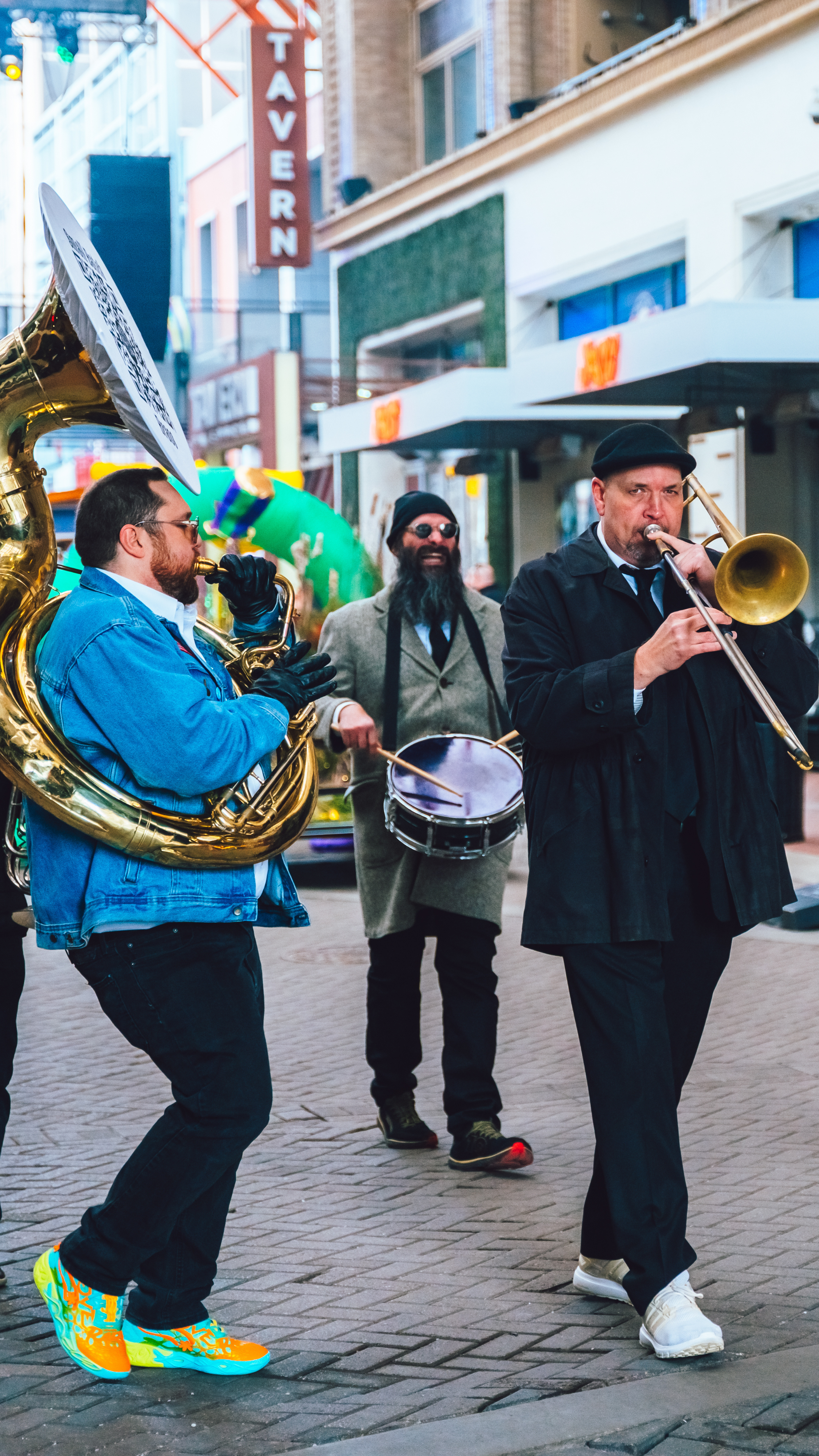 A live brass band playing their instruments.