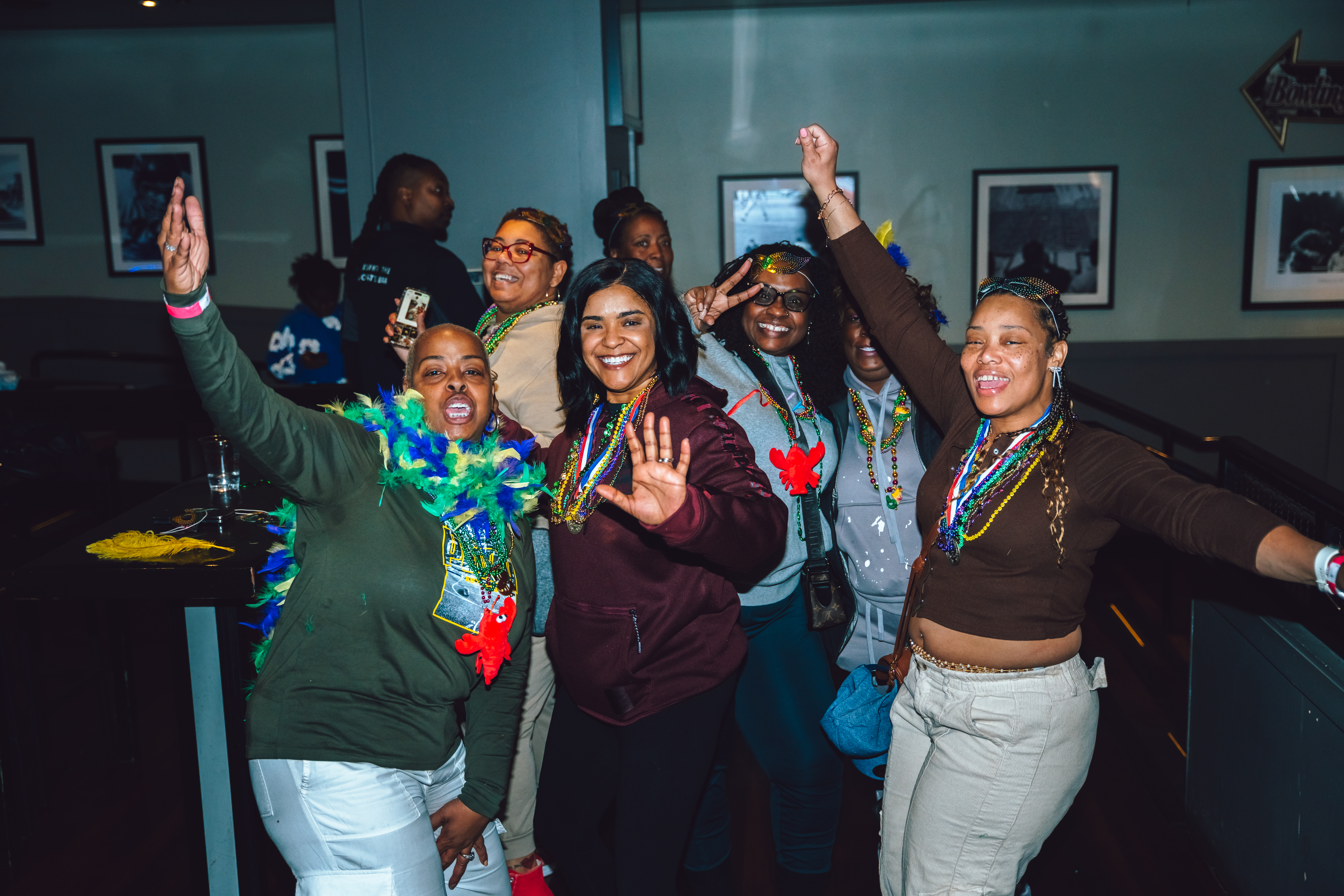 Woman dancing in Sports and Social at Mardi Gras Live!