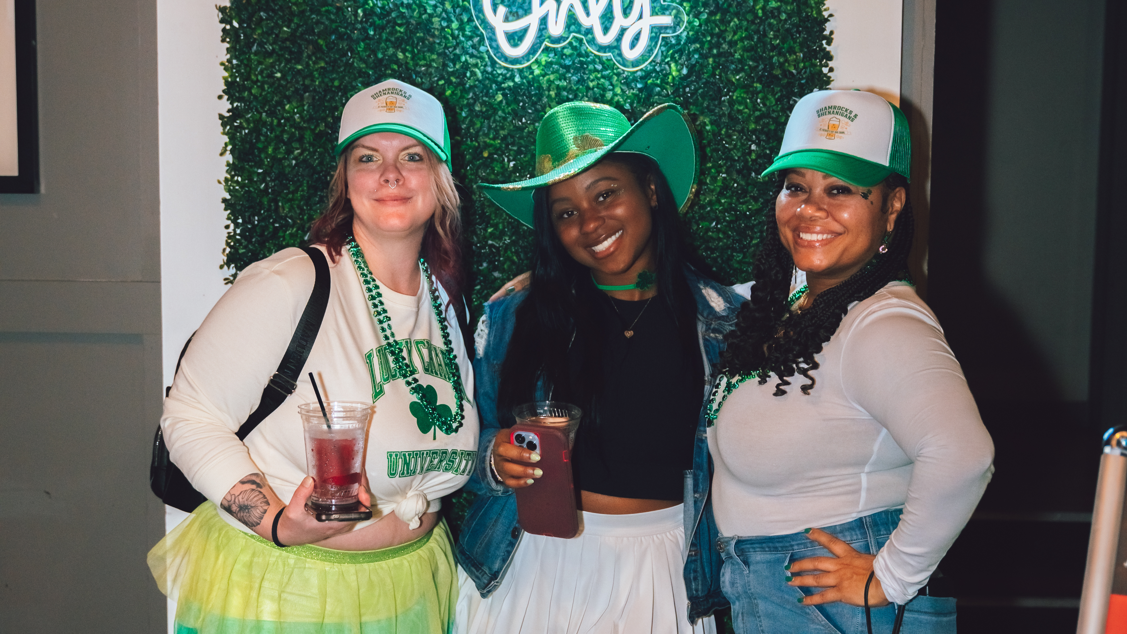 An image of 3 women at Shamrocks and Shenanigans posing for a pic.