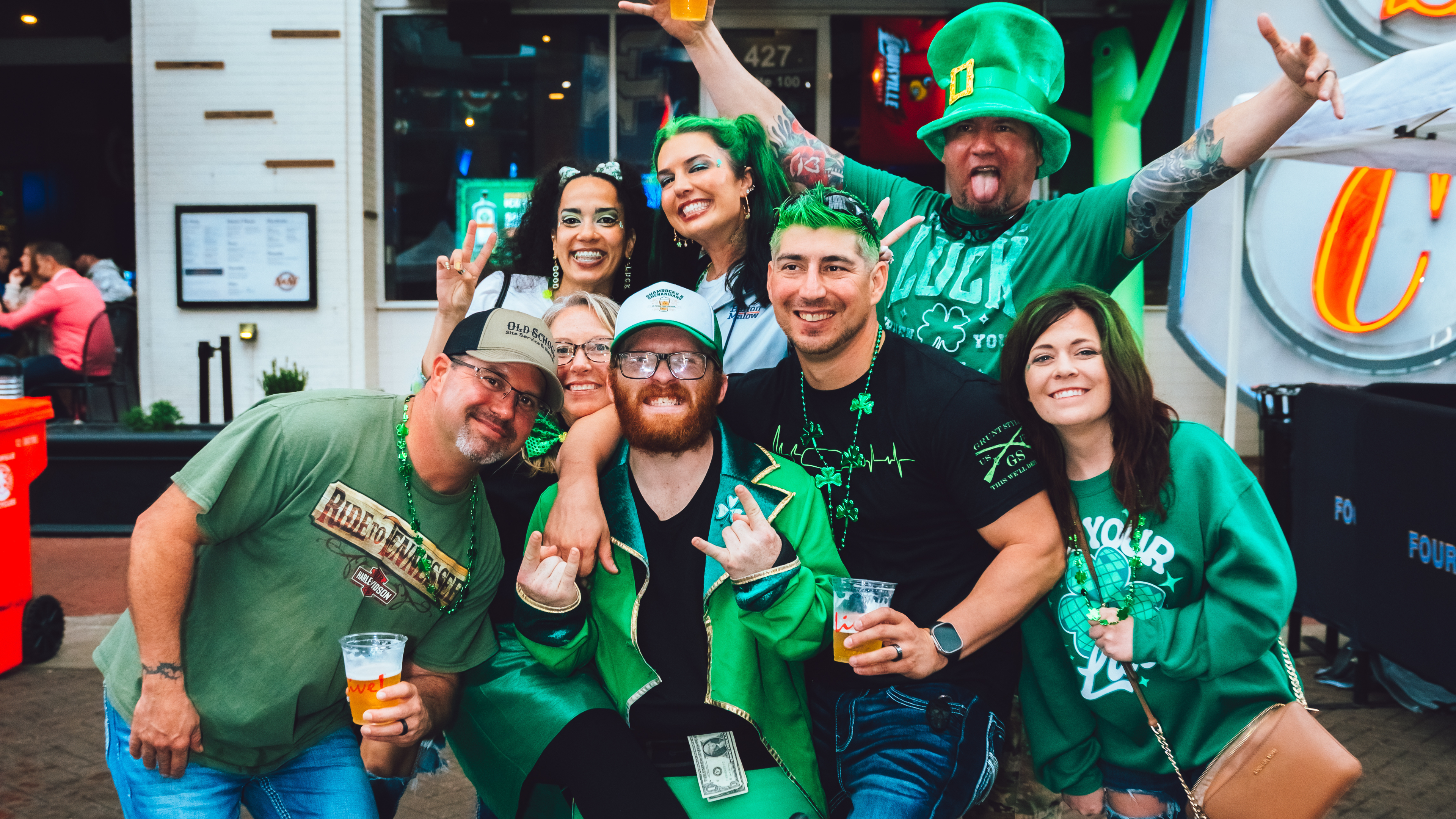 A group photo of people posing for a pic at Shamrocks and Shenanigans.