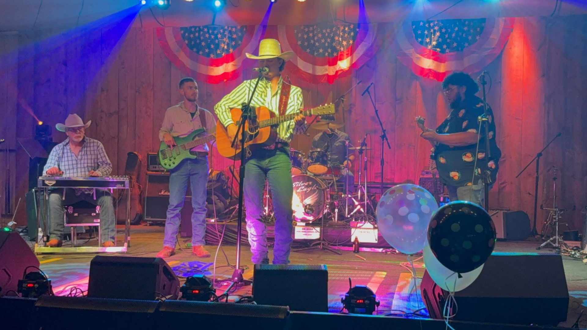 An image of the 21 Dust Band performing on stage.