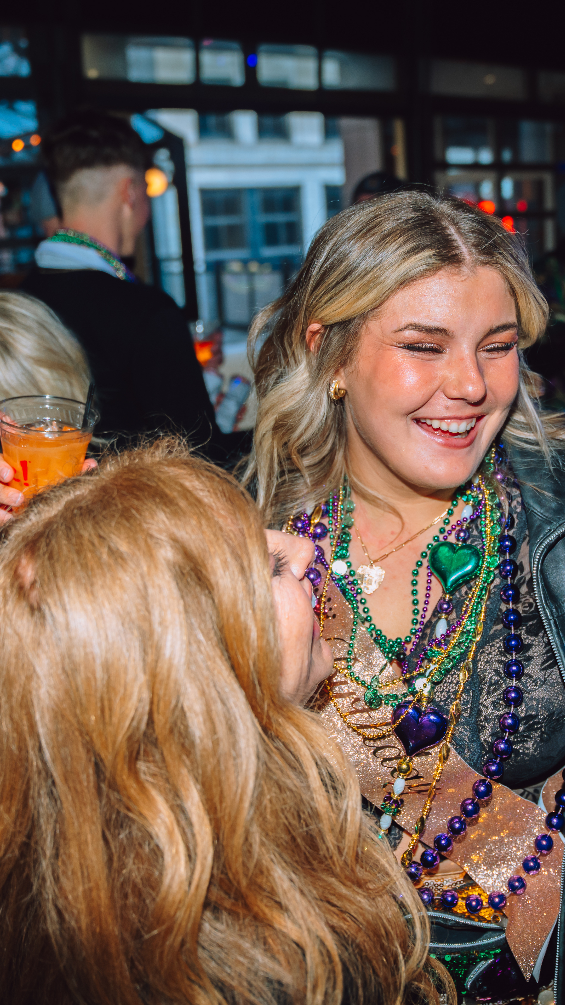Two girls dancing at Mardi Gras in PBR.