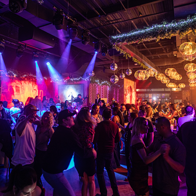 Guests on the dance floor of Besos y Abrazos.