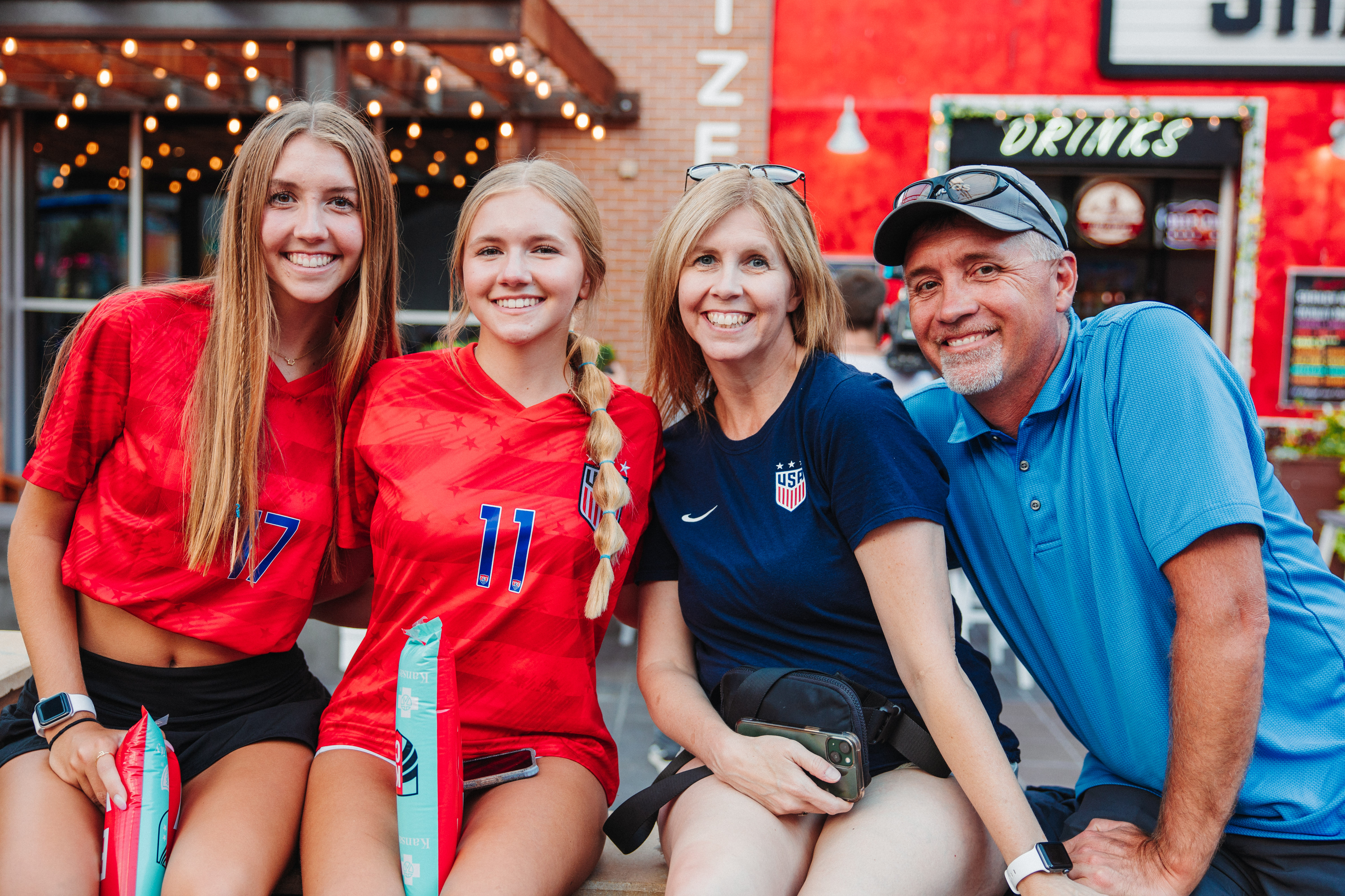 Mom, Dad, and two daughters at Premier League watch party at Power and Light District.