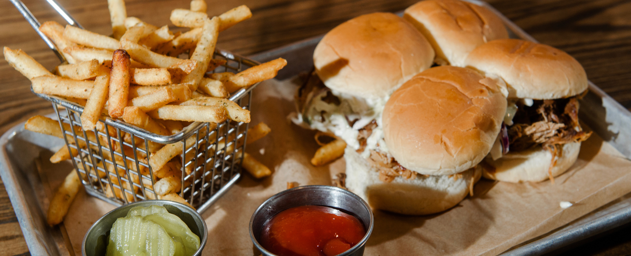 Tray of food with sliders and fries