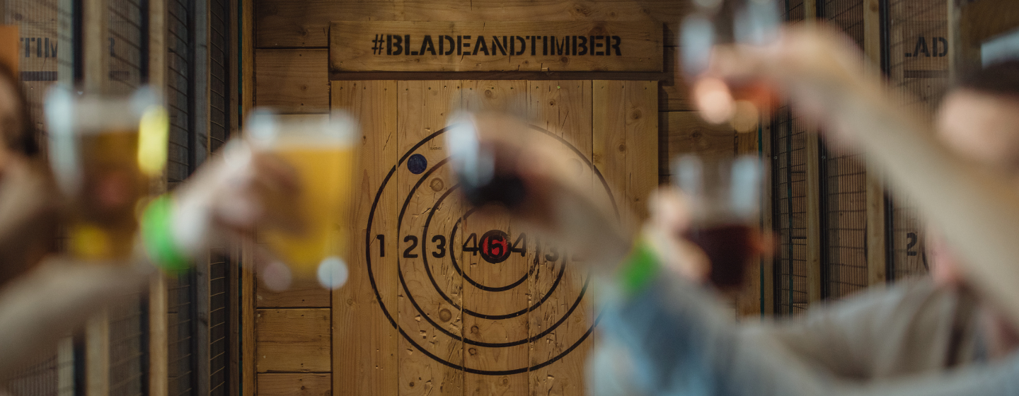 Picture of bullseye as people cheers with beers