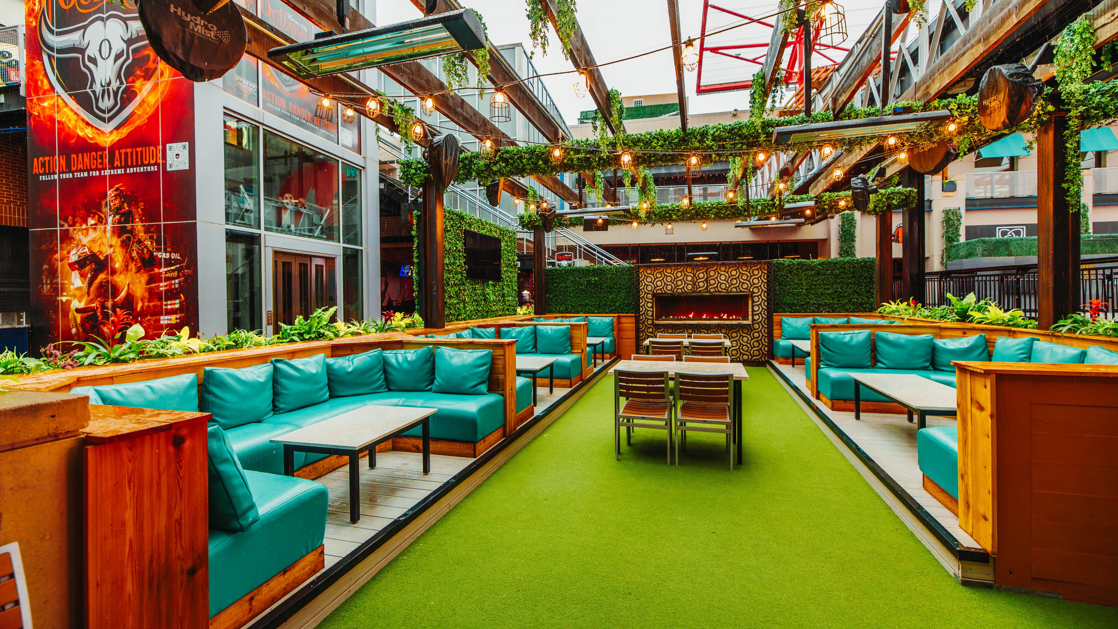 Outdoor patio with lounge booth seating and firepit.