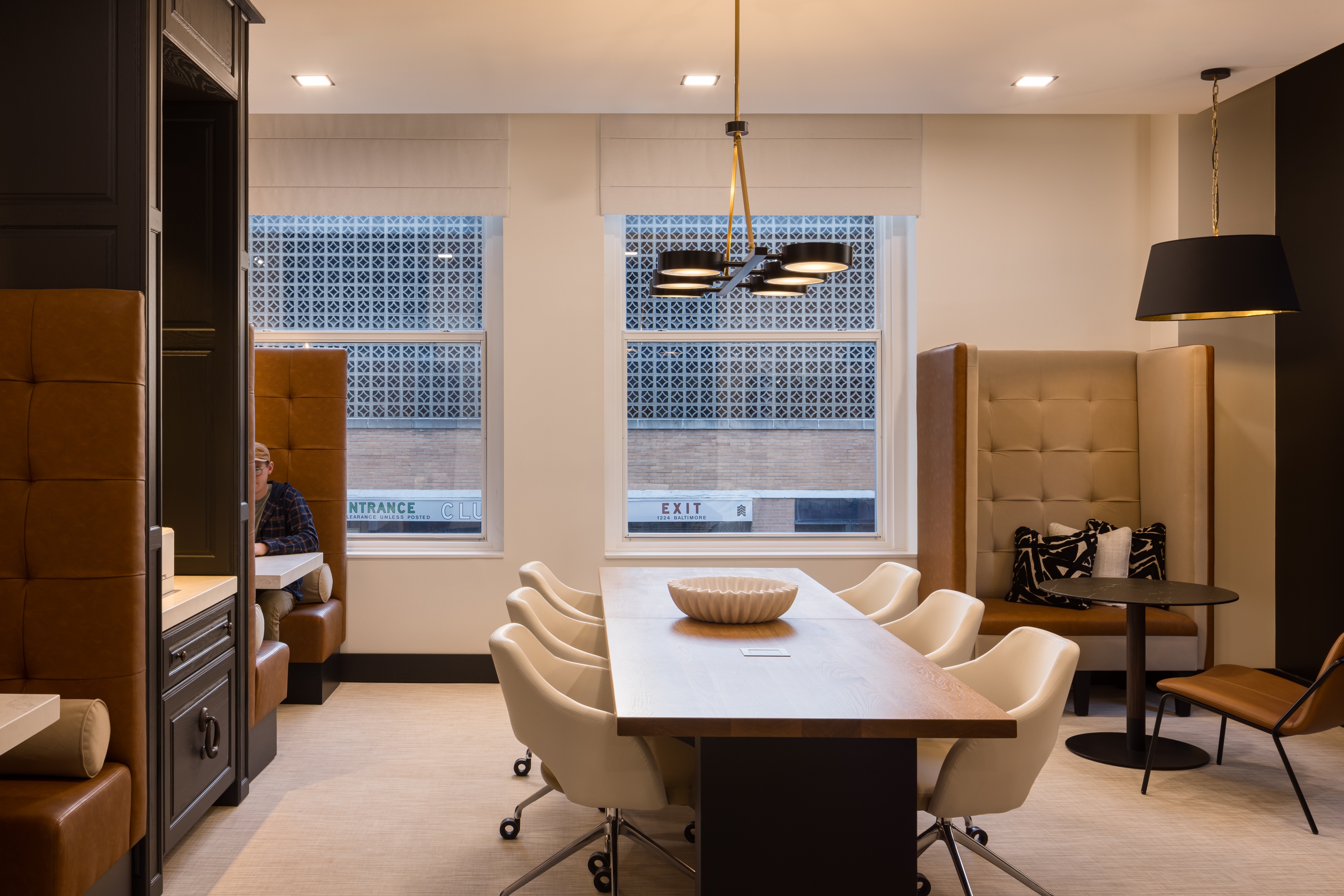 Midland Lofts workspace booths and long table.