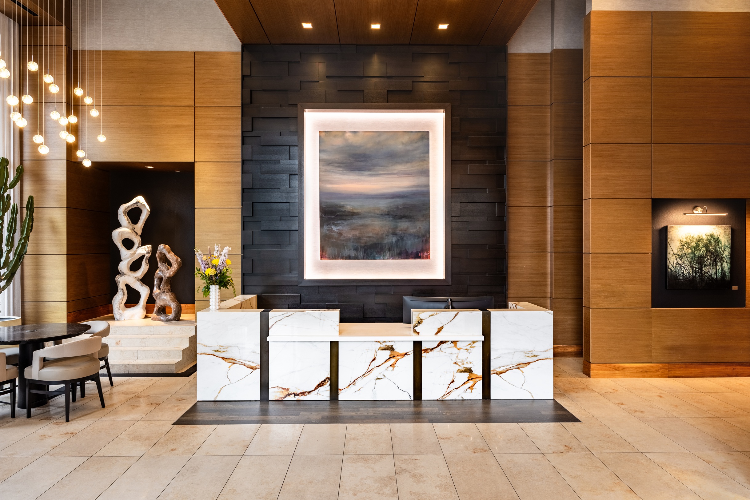 Stylish lobby with wood and marble details in the One Light luxury apartment building.