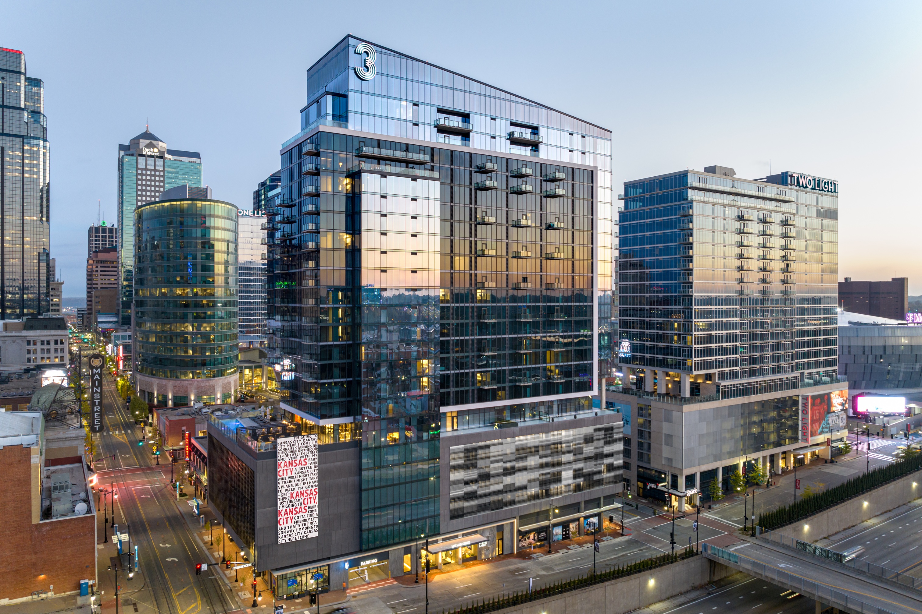 Three Light luxury apartment building exterior photo.