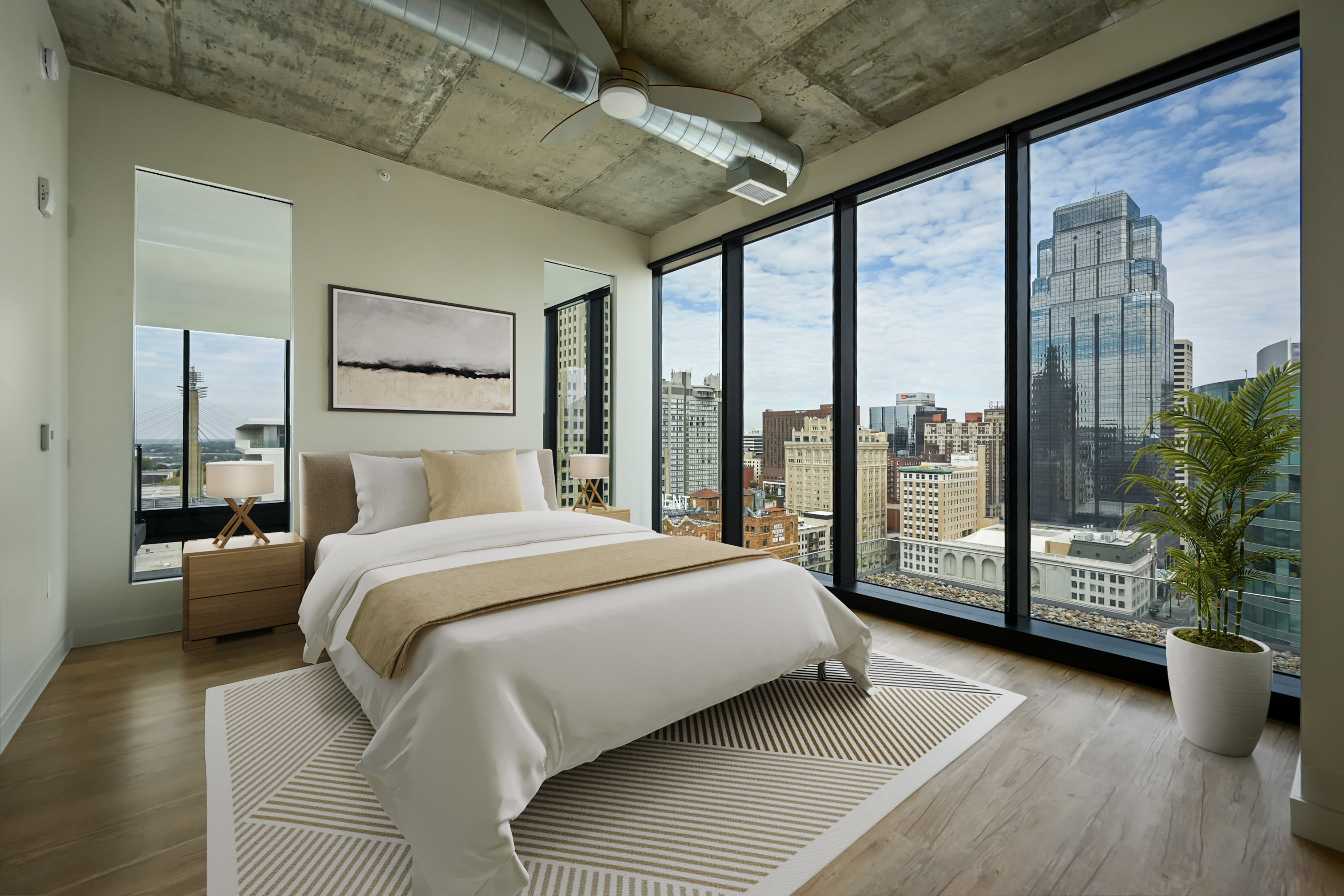 Furnished bedroom with views at Three Light luxury apartments.