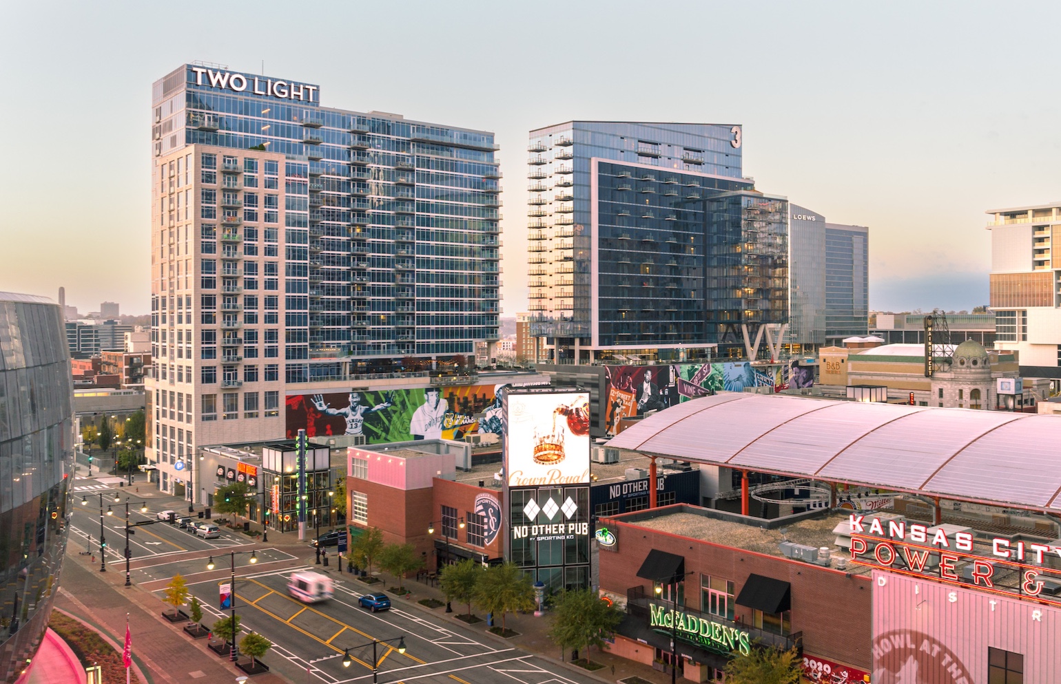 Exterior of Two Light Luxury Apartments at dusk.