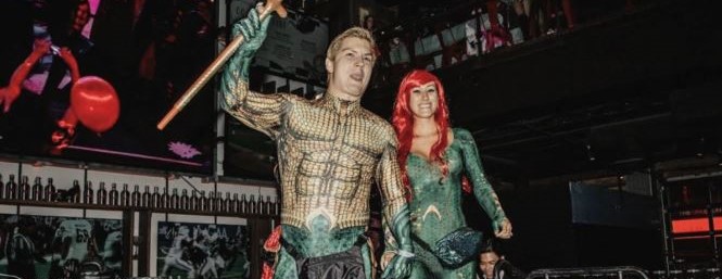 Two guests dressed as Aquaman and Mera at Live! at the Battery Halloween party.
