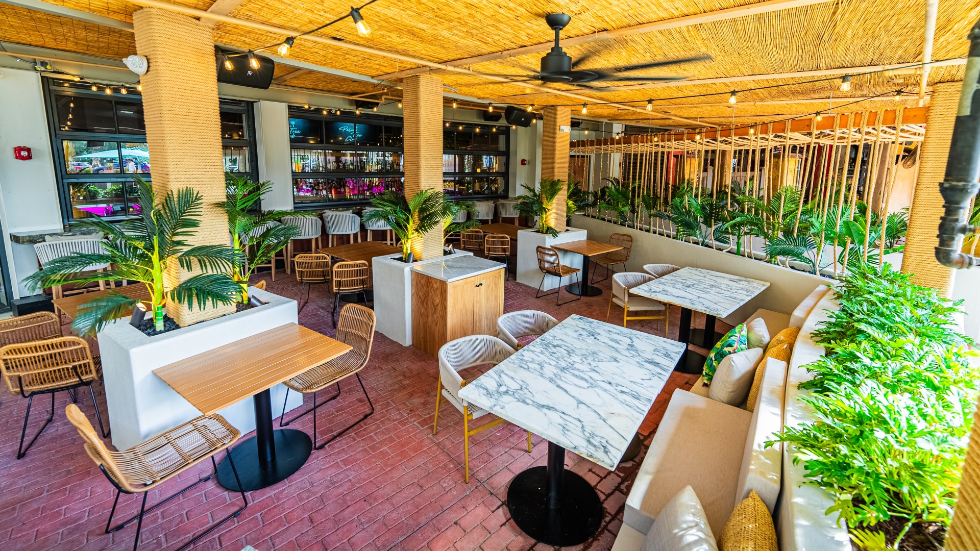 Outdoor patio dining at Palm Tree Club in Orlando.