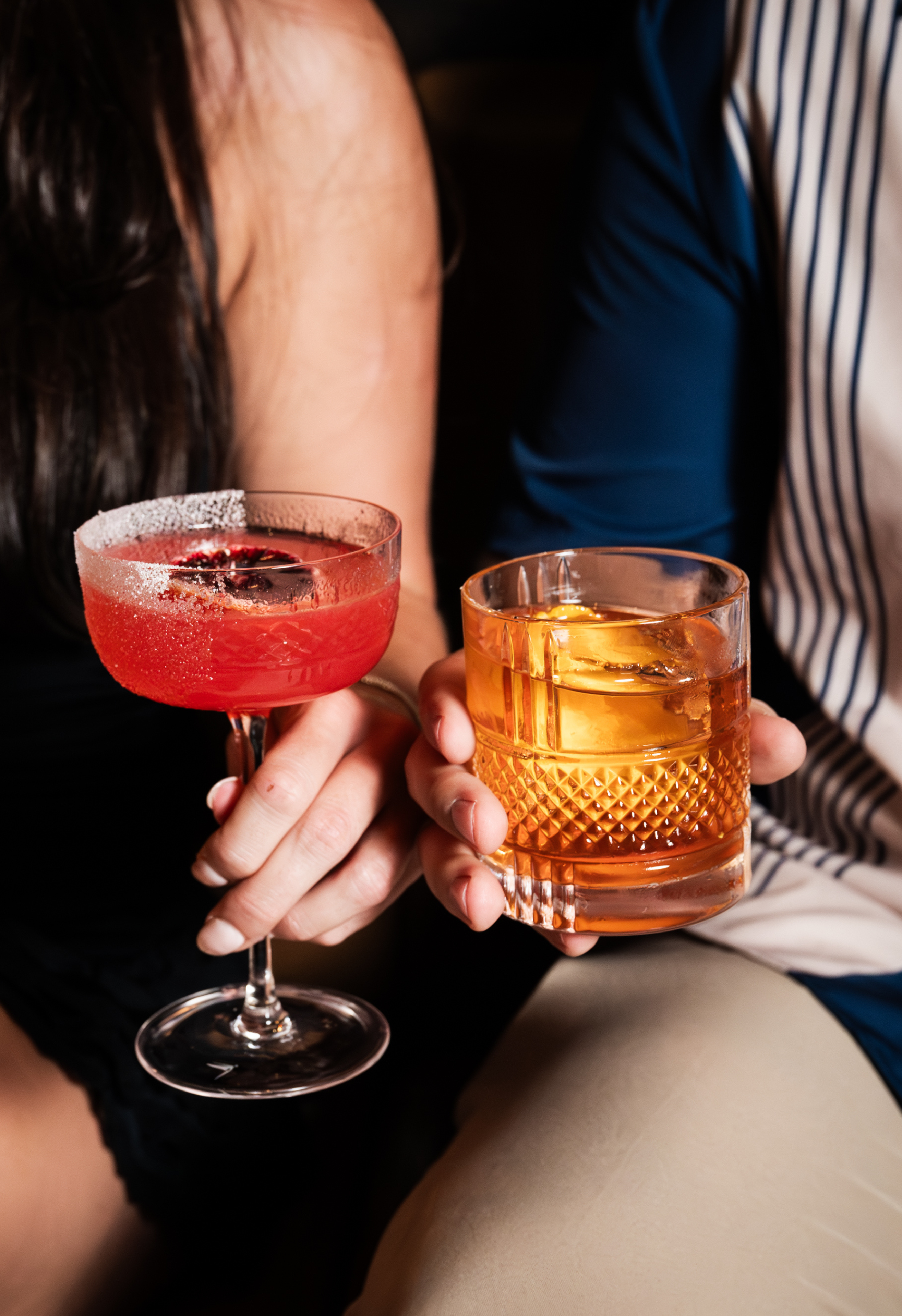 Two couple holding drinks