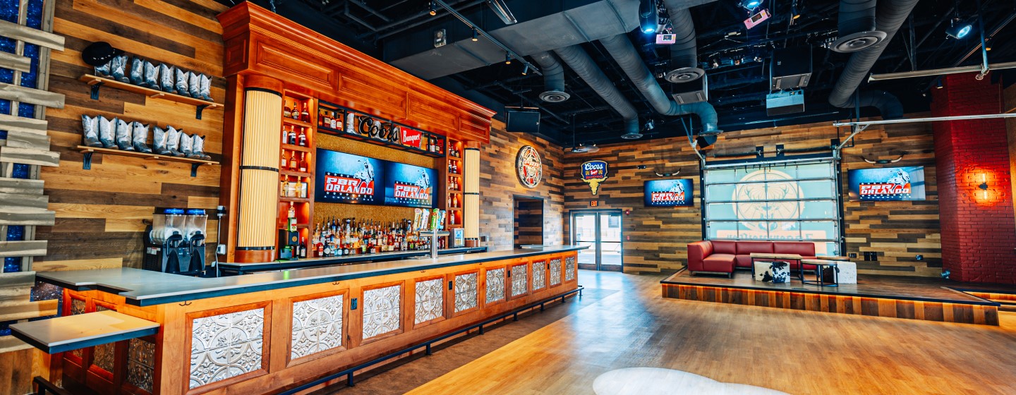 PBR Cowboy Bar full bar, dance floor, and private seating area at Live! at the Pointe Orlando.