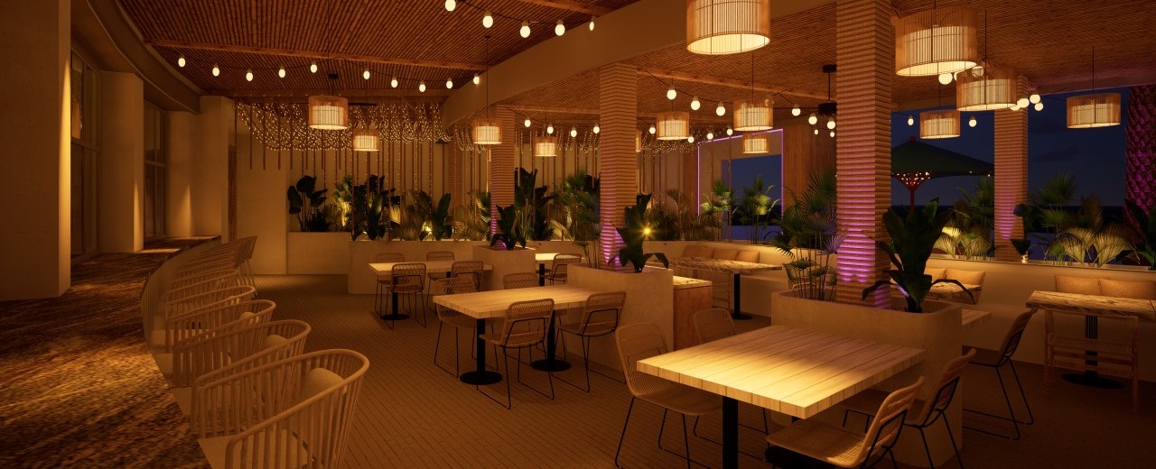 Outdoor dining area at night at Palm Tree Club in Orlando.