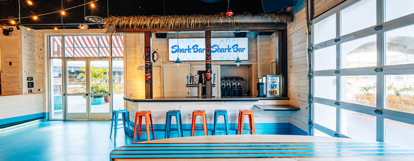 Live! at the Pointe Orlando Shark Bar's smaller bar with orange and teal barstools.