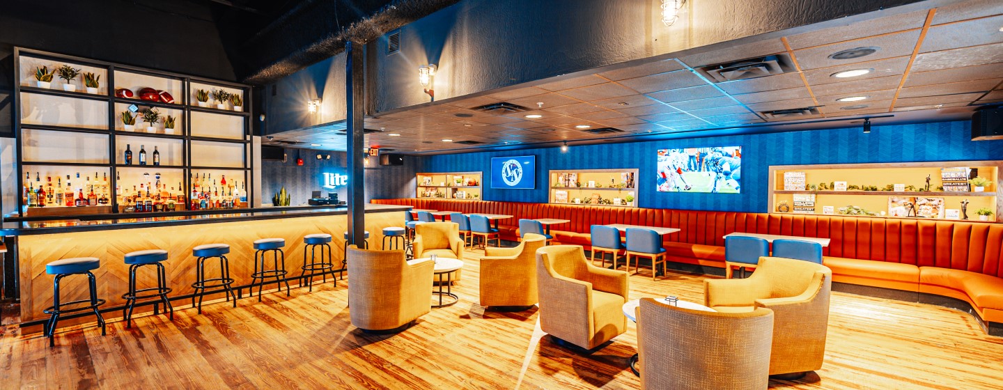 Upstairs bar and seating at Sports & Social at Live! at the Pointe Orlando.