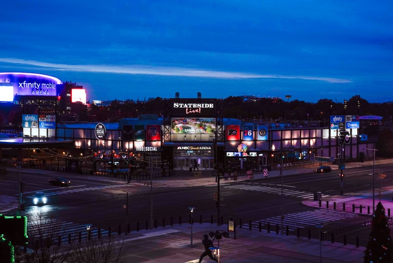 Exterior of Stateside Live! and surrounding area at night.