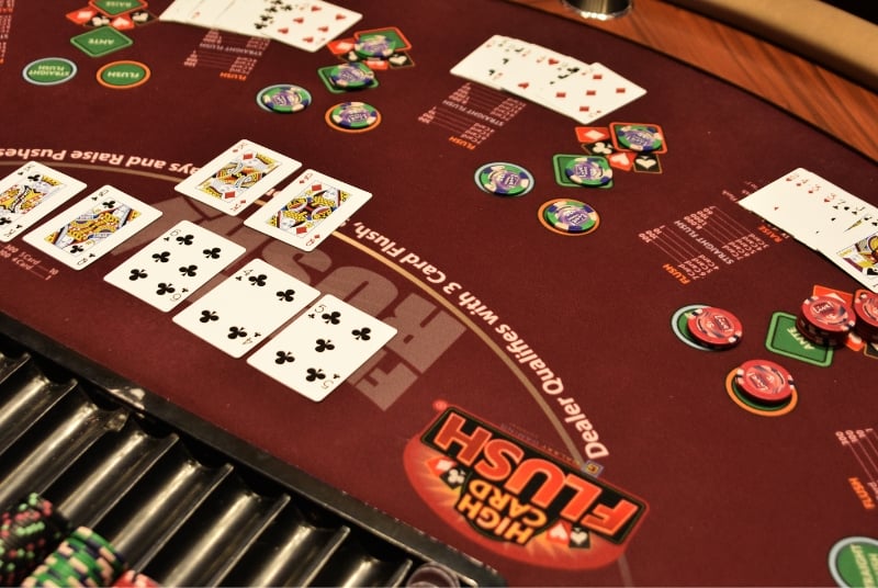 overhead view of a table felt for a Hard Card Flush Table at Live! Casino