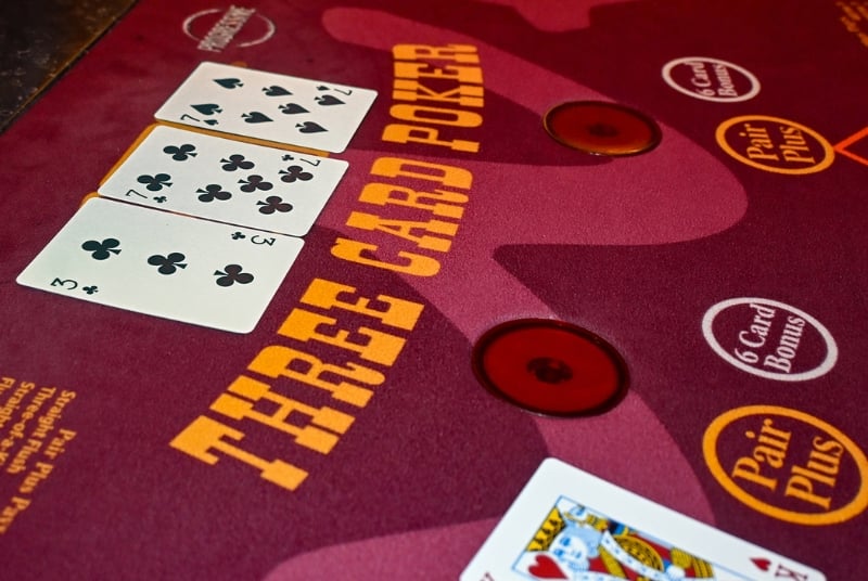 Overhead view of a table felt for Three Card Poker