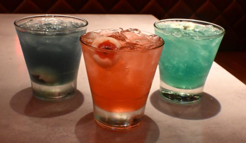image of a dark blue cocktail, red cocktail, and a light blue cocktail at live casino louisiana luk fu
