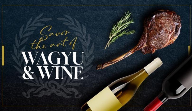image of blue background with wagyu tomahawk steak, a sprig of rosemary, and two bottles of wine. text reads savor the art of wagyu and wine