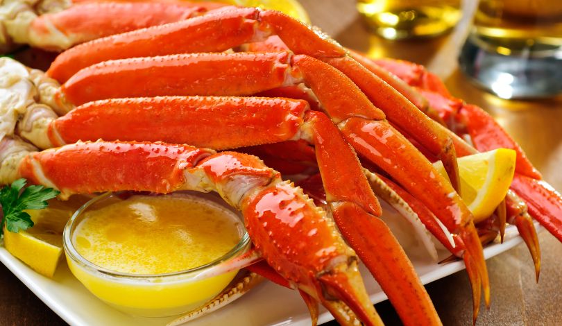 image of snow crab legs with a small bowl of butter