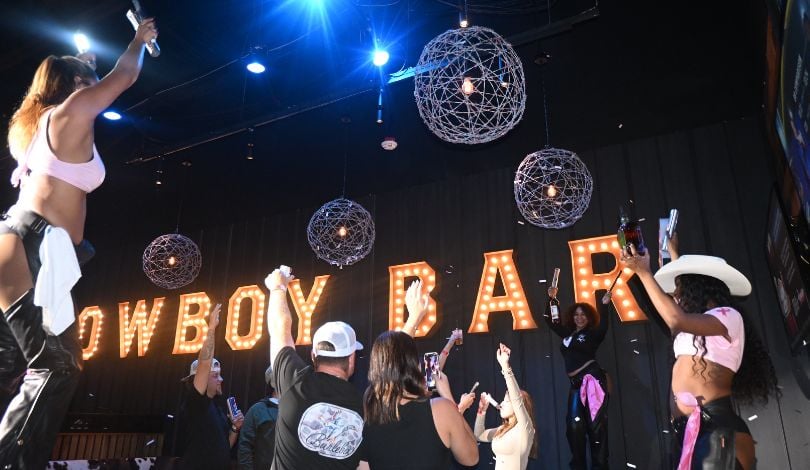 image of people celebrating in a vip booth at pbr louisiana