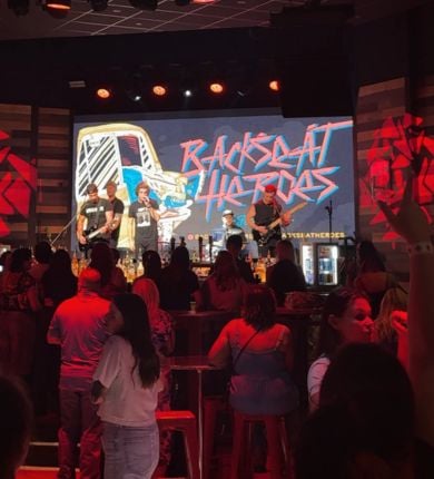 image of 5 men playing instruments on stage at PBR louisiana in front of a crowd