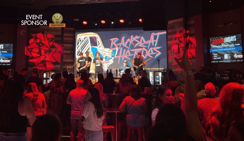 image of people dancing in the crowd and backseat heroes band performing on stage at pbr louisiana
